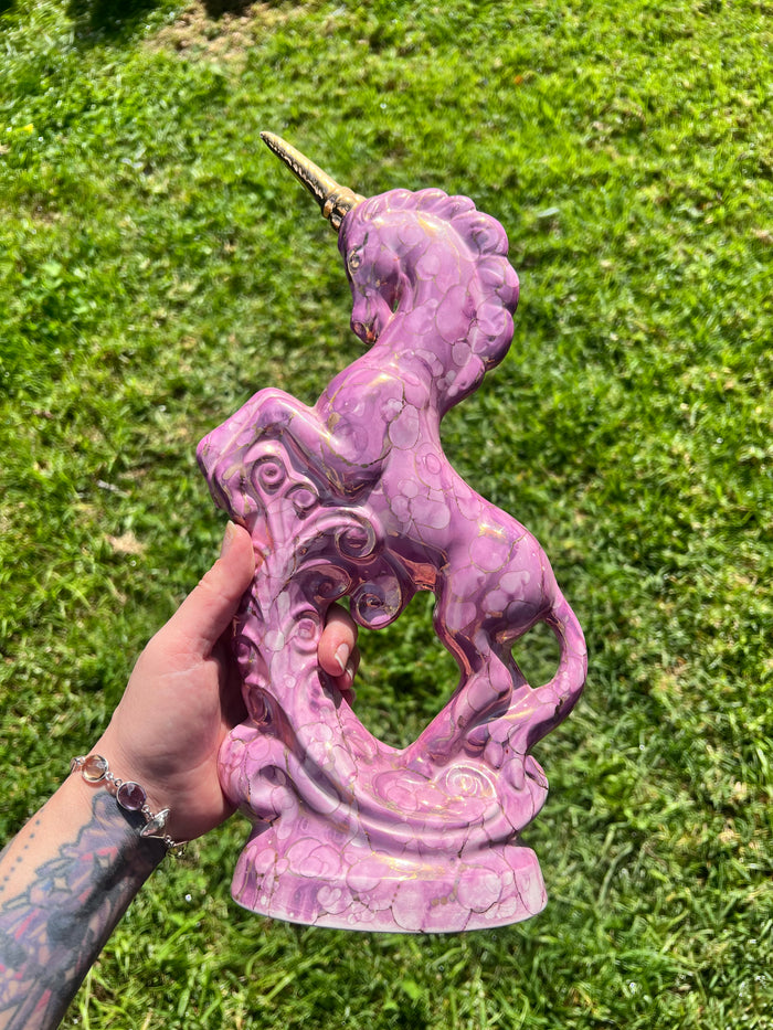 Pink and gold ceramic unicorn statue