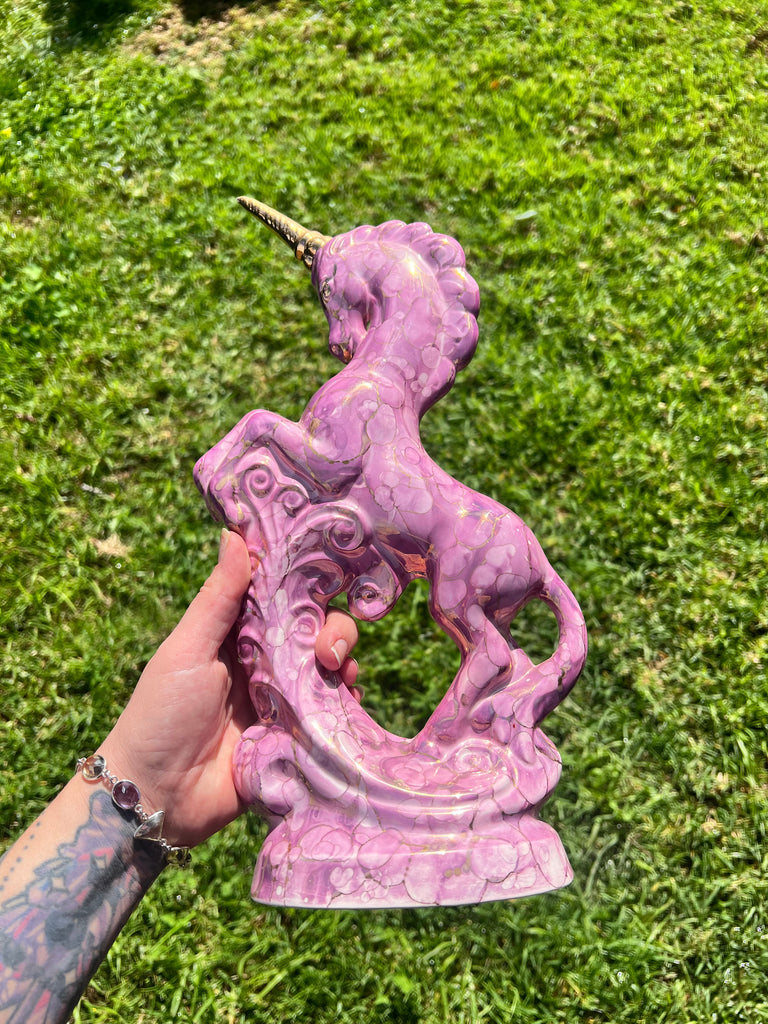Pink and gold ceramic unicorn statue