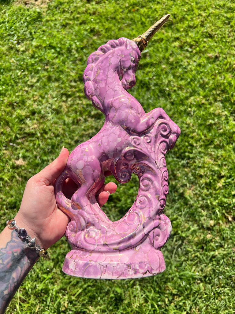 Pink and gold ceramic unicorn statue