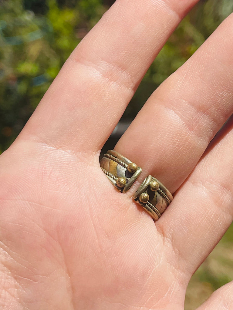 Tribal brass ring with green stone adjustable between sizes 7-8