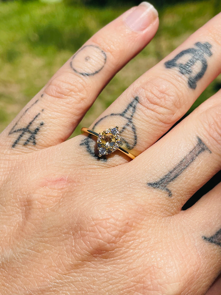 Yellow gold plated ring with sparkly zirconium size 6